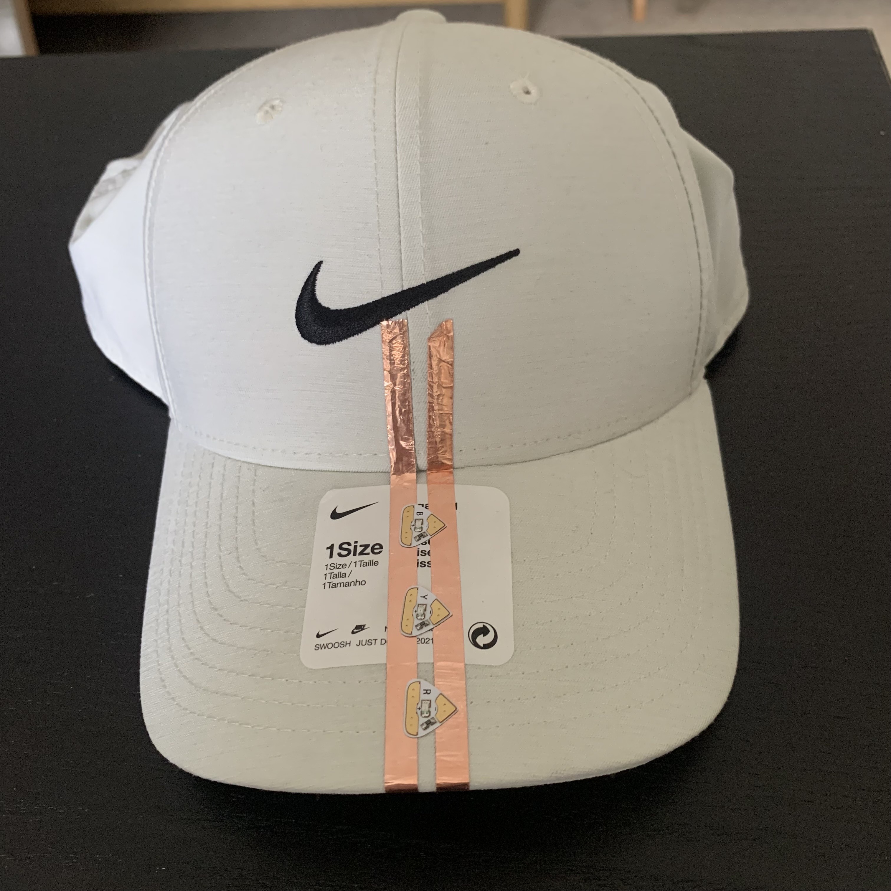 The Copper Tape wraps around the underside of the hat where the coin battery is placed loosely and connects via the user wearing the hat.