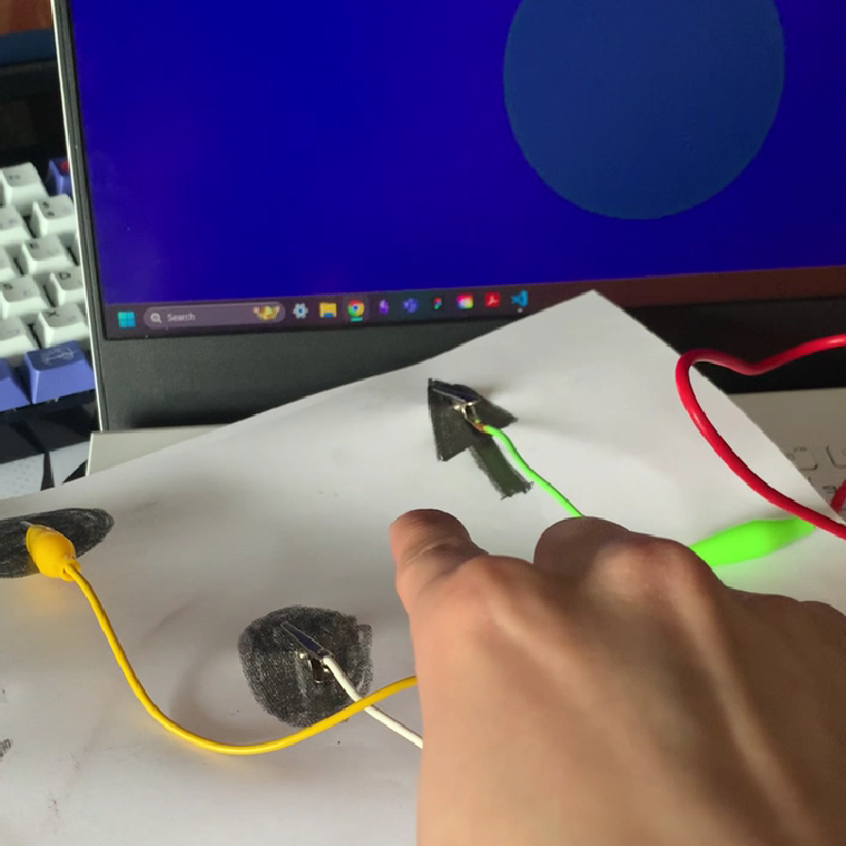 Close up image of the interaction working together with the sketch on the screen.