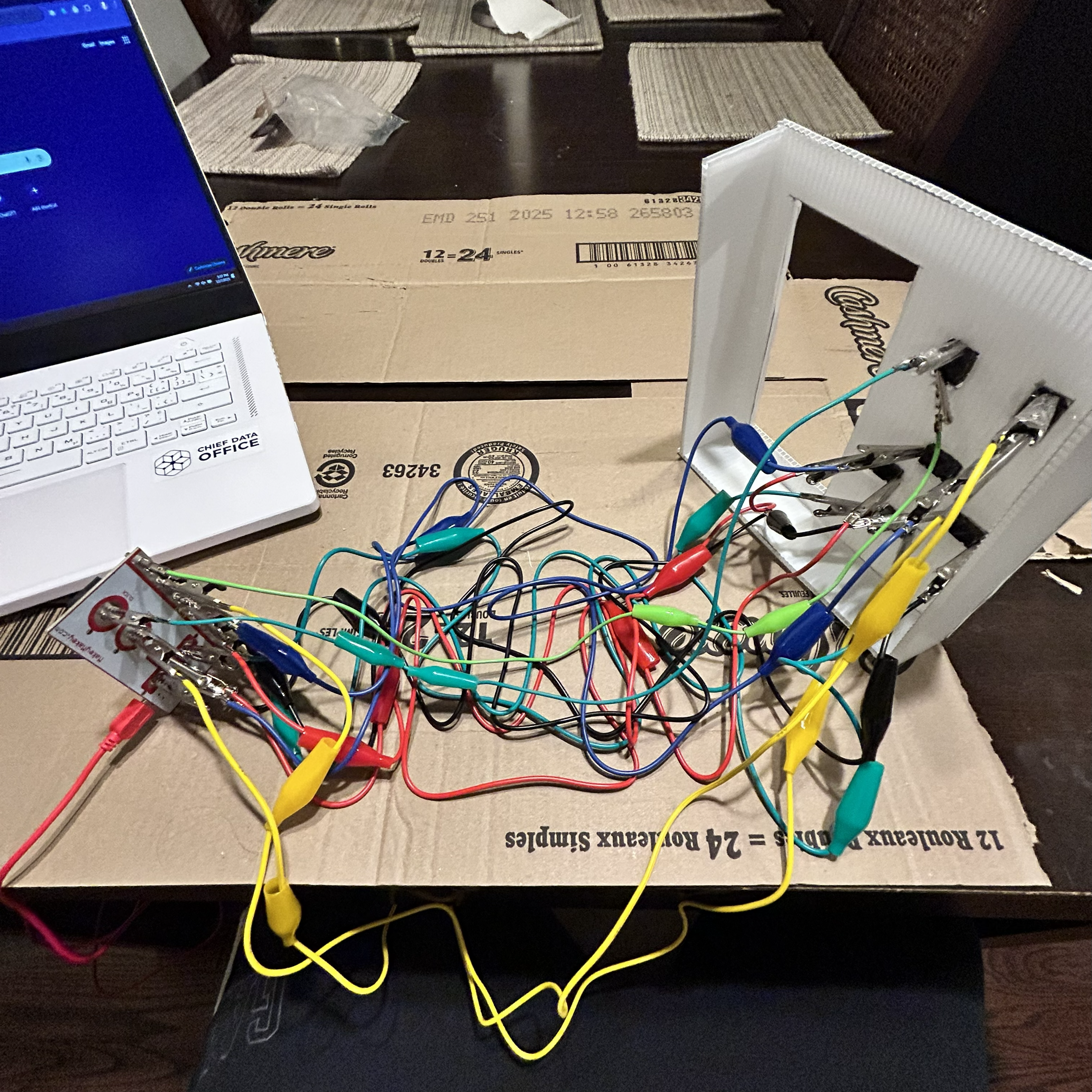 Displaying the network of wires attached to the buttons ensuring they're secure. 